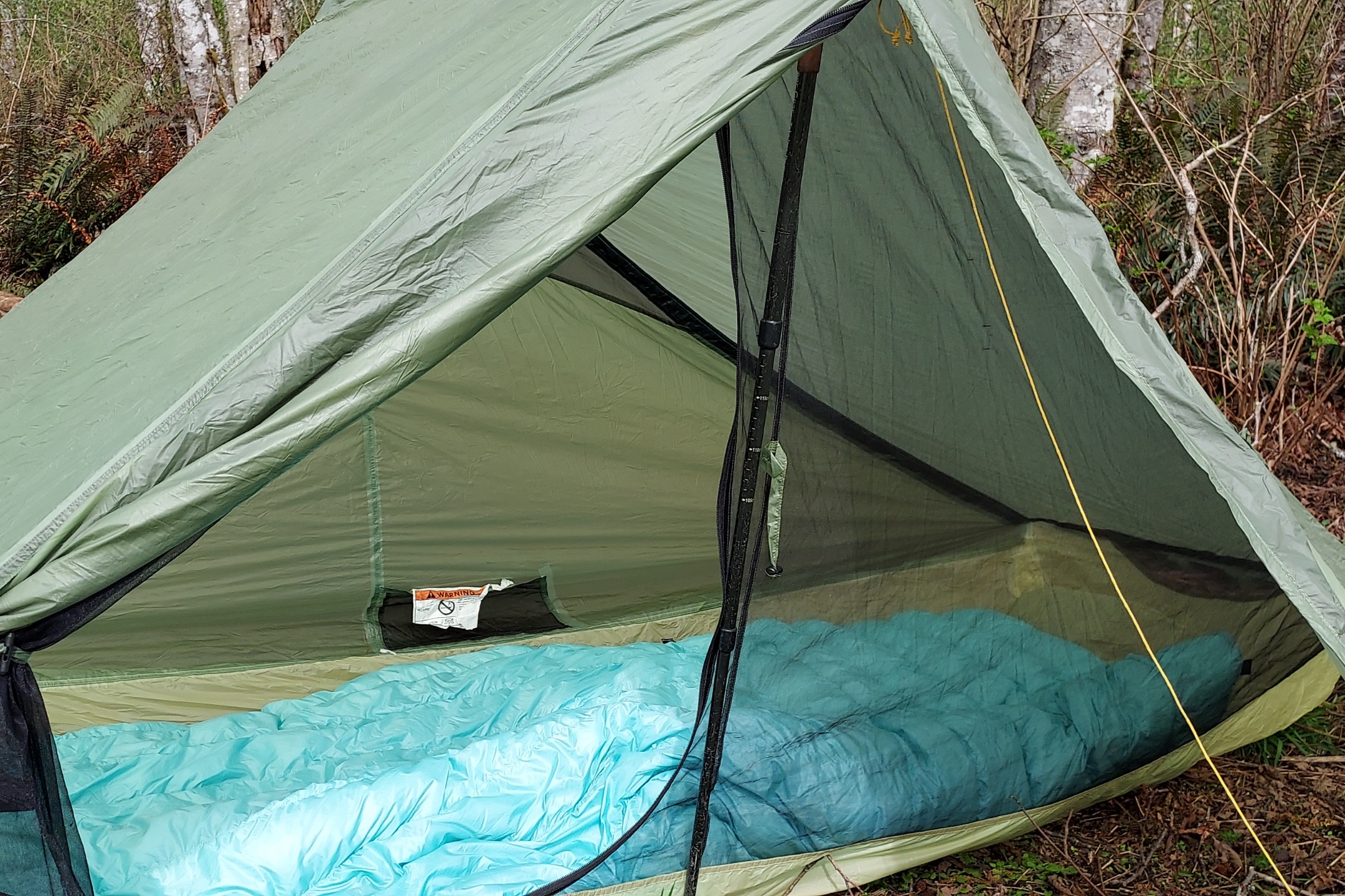 The UGQ Bandit 20 Quilt in a tent