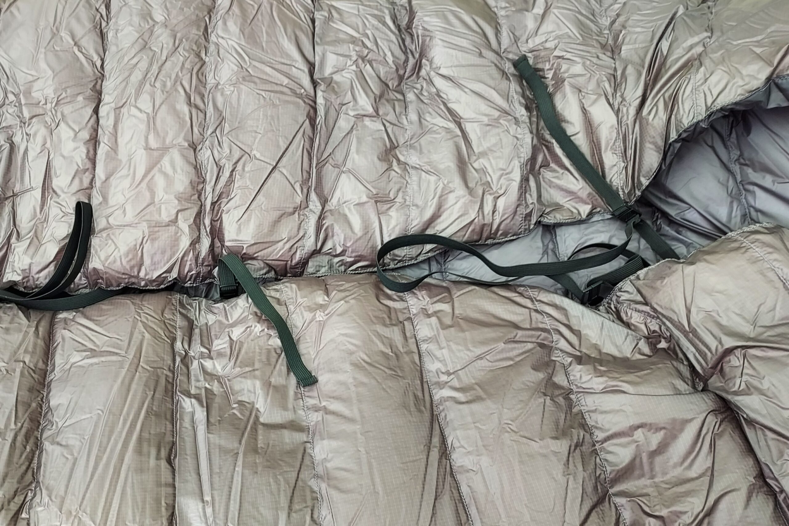 The pad straps for the Western Mountaineering AstraLite Quilt