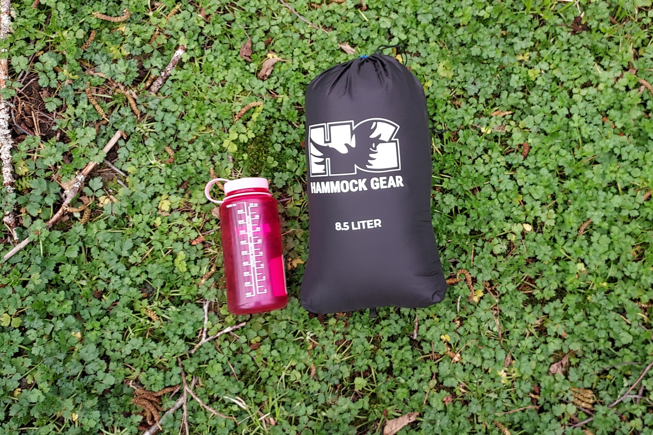 Hammock Gear Burrow 20 Quilt packed down with a Nalgene for scale