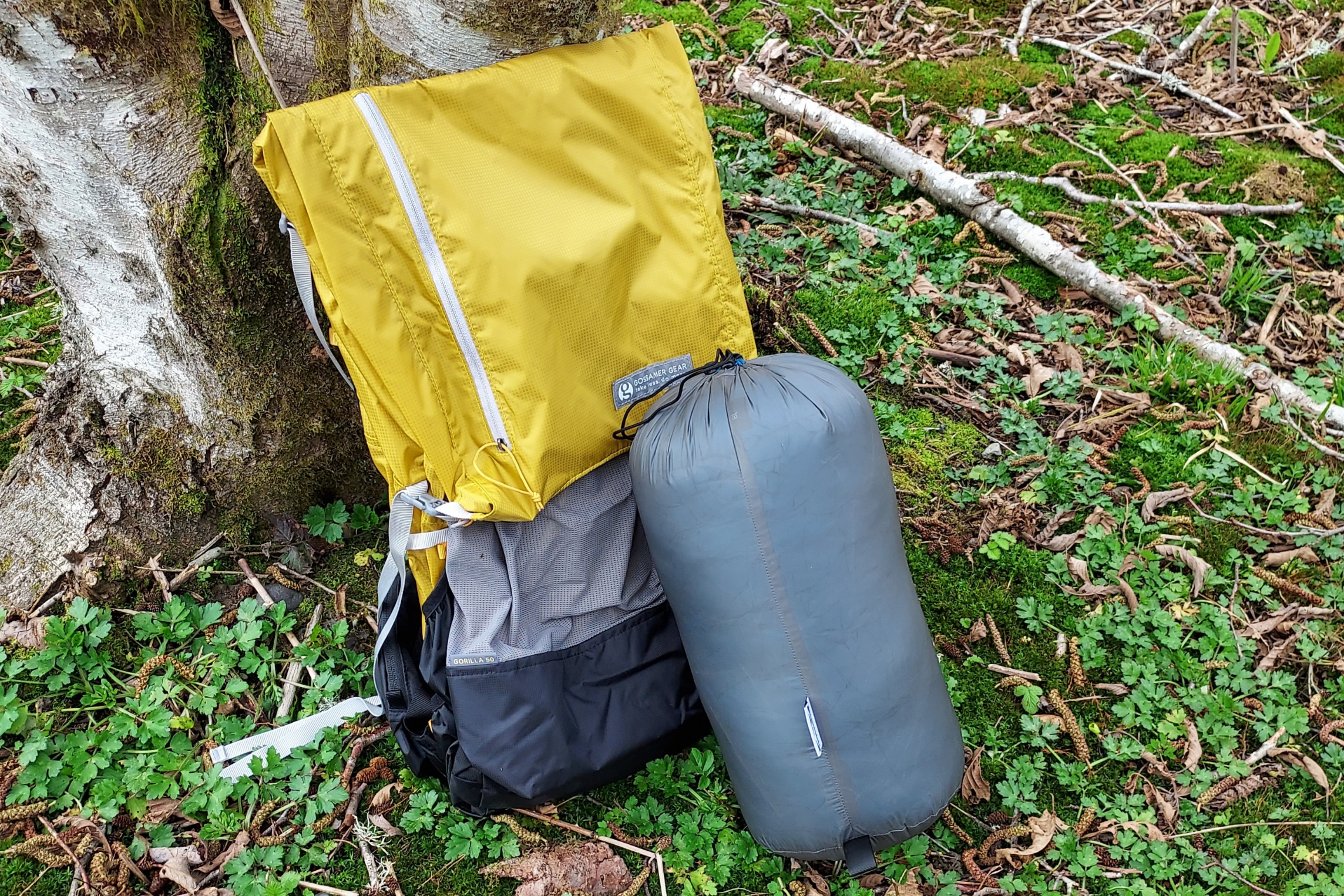 Katabatic Flex 22 Quilt packed down with a standard ultralight 50L backpack for scale