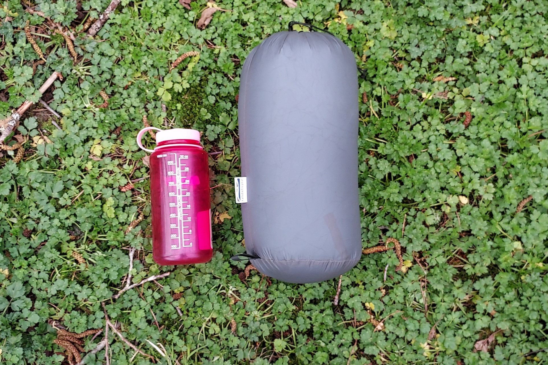 Katabatic Flex 22 Quilt packed down with a Nalgene for scale