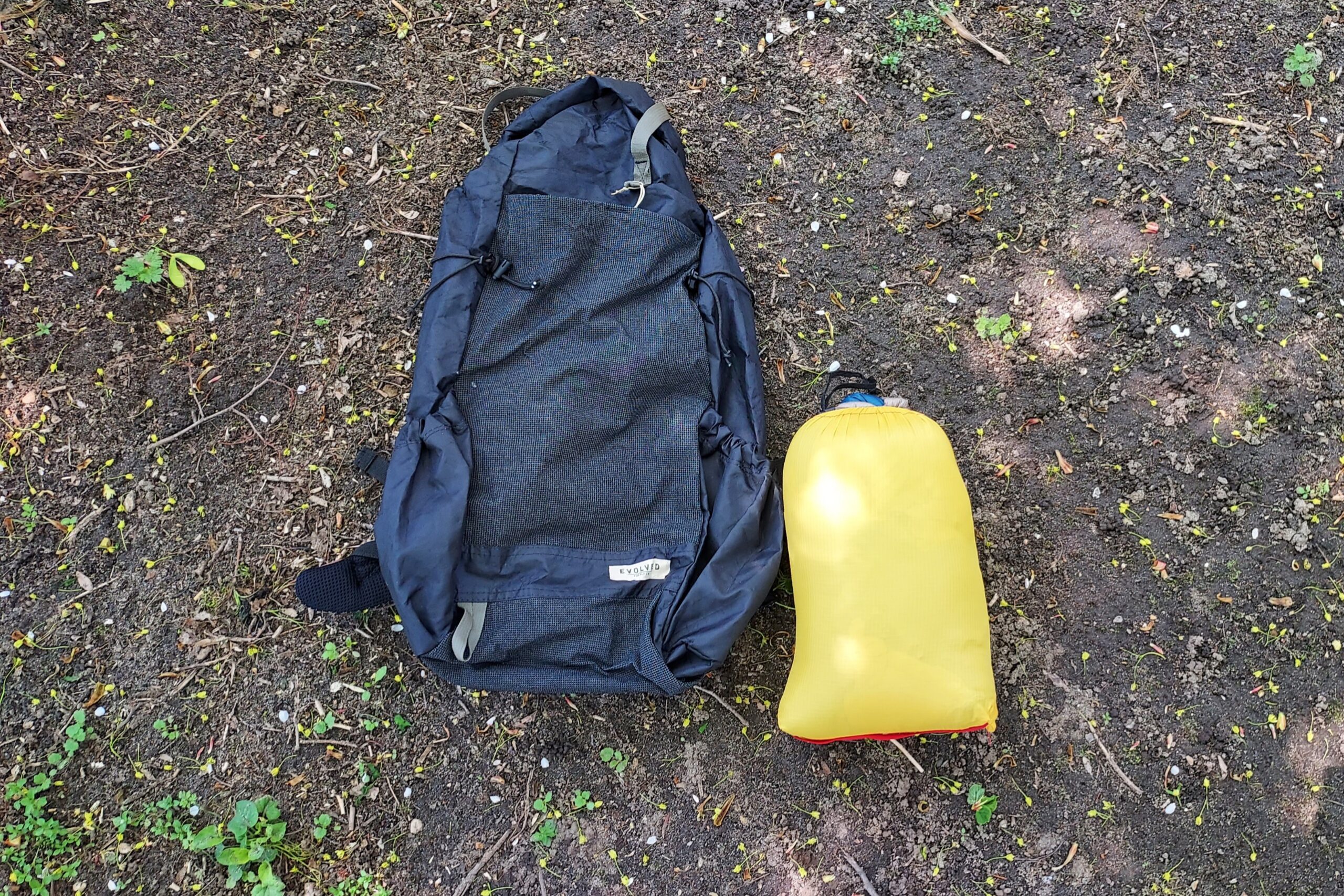 Loco Libre Operator Series Ghost Pepper 20 Quilt packed with a standard 30L ultralight backpack for scale