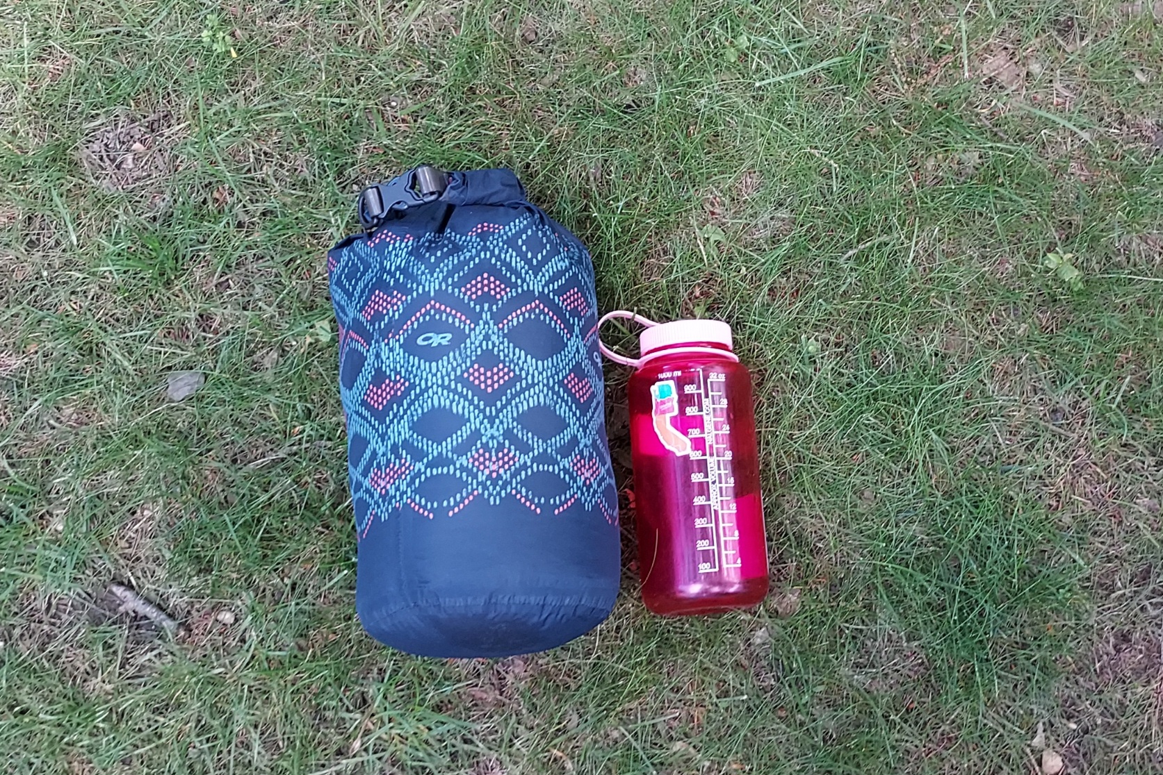 Hyperlite Mountain Gear 20-Degree Quilt packed down with a Nalgene for scale