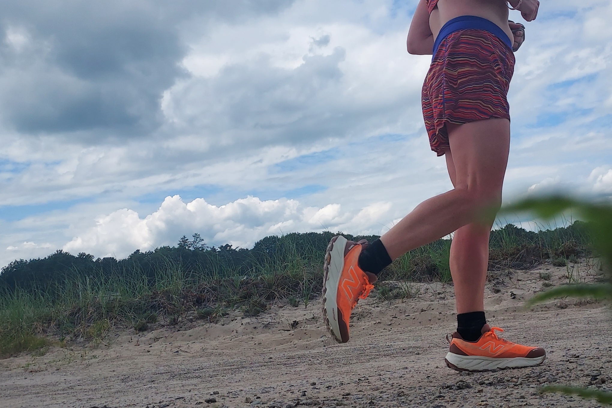 Runner on the beach wearing the New Balance Fresh Foam Hiero 9
