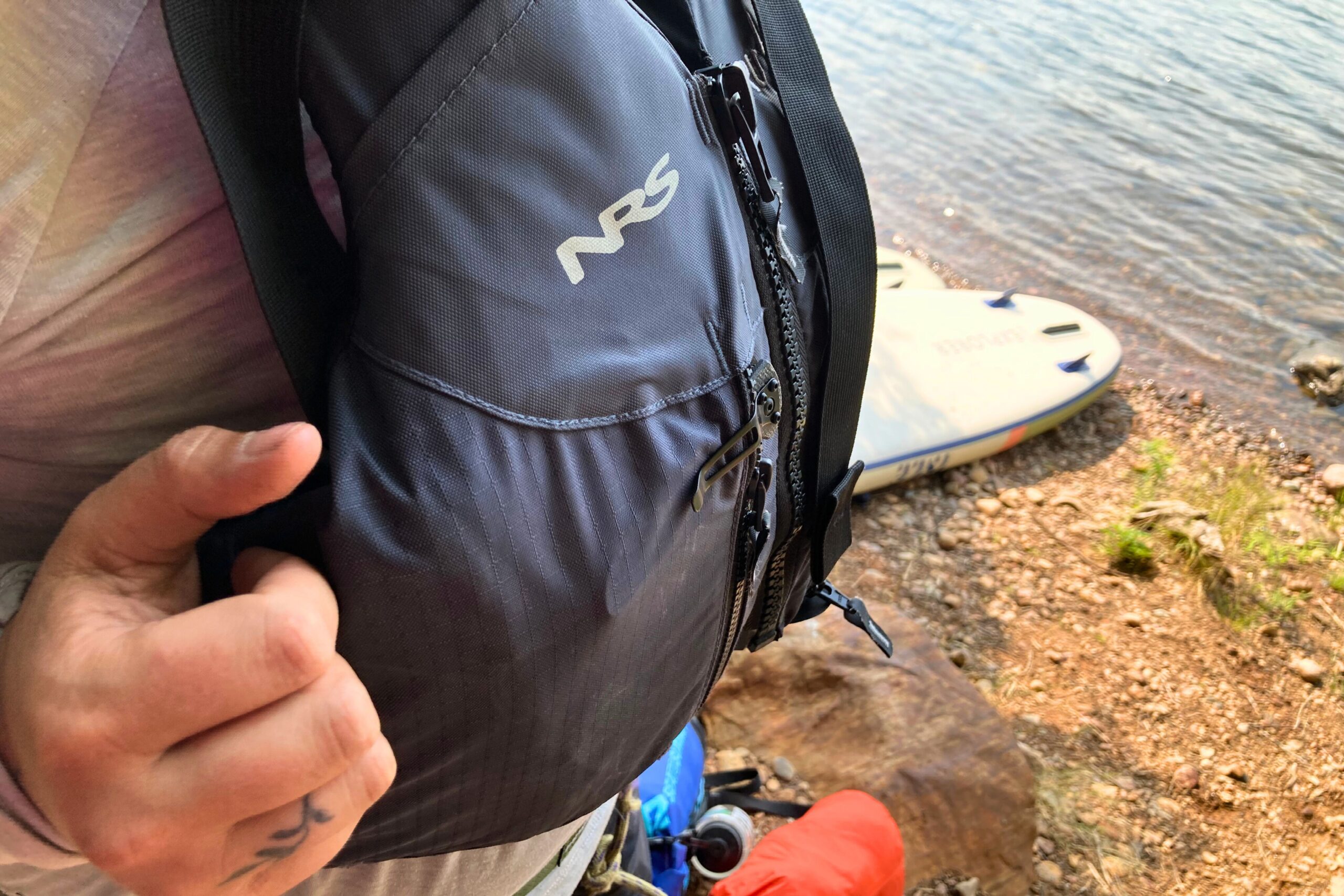 The CRKT Drifter Pocket Knife clipped in the pocket of an NRS life jacket