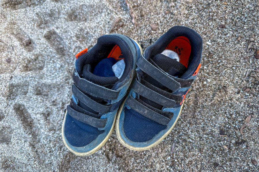 Top view of Five Ten Freerider shoes showing Velcro straps and sand-covered uppers.