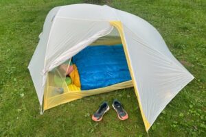 Hiker in a tent in the ZPacks 20F (-7C) Twin Quilt