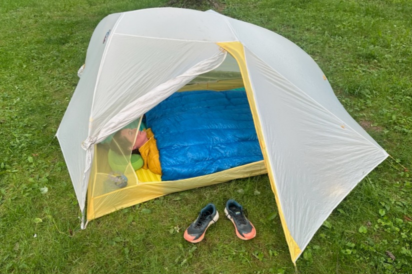 Hiker in a tent in the ZPacks 20F (-7C) Twin Quilt