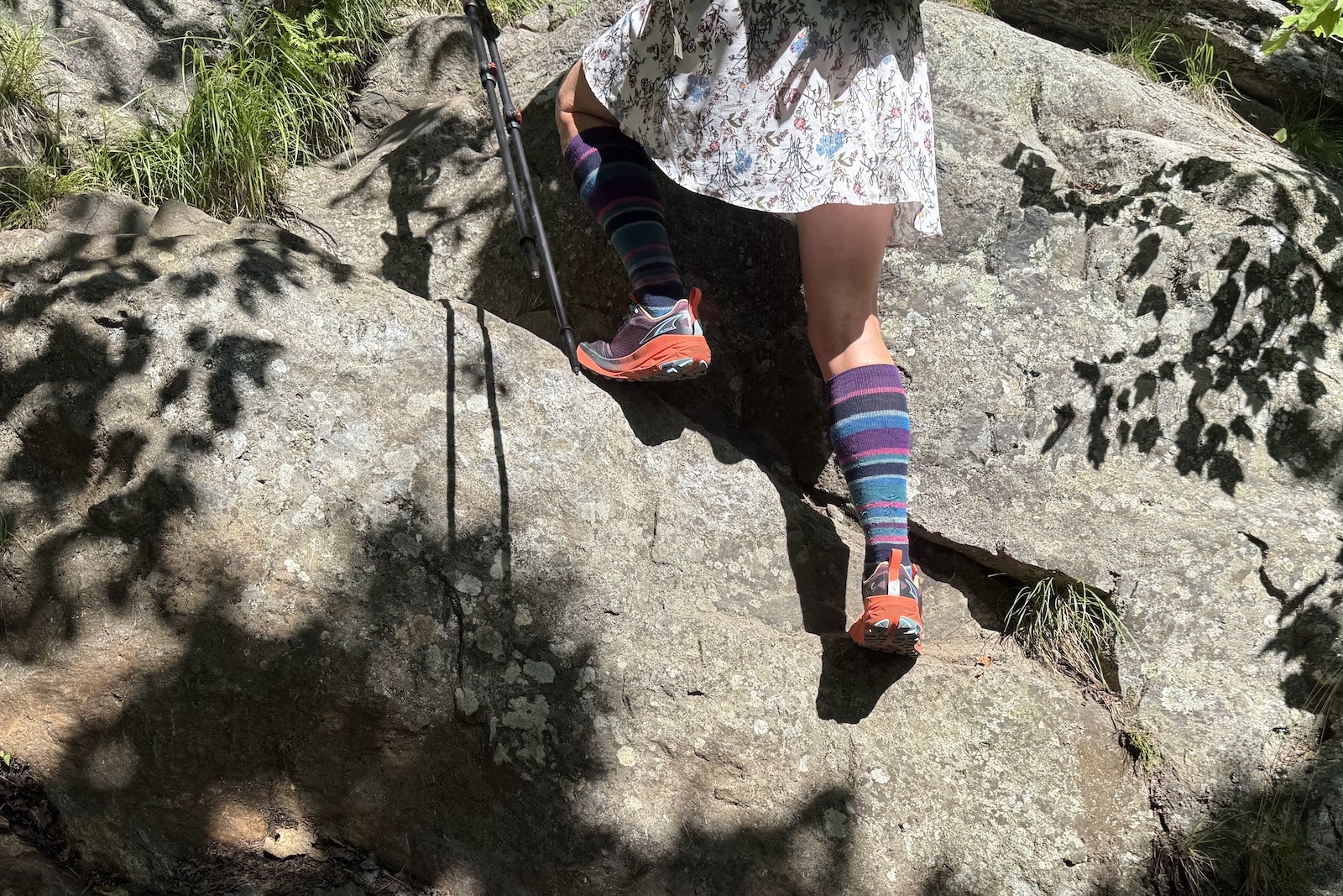 Hiker in the Altra Experience Wild 2 climbing Mount Monadnock, NH