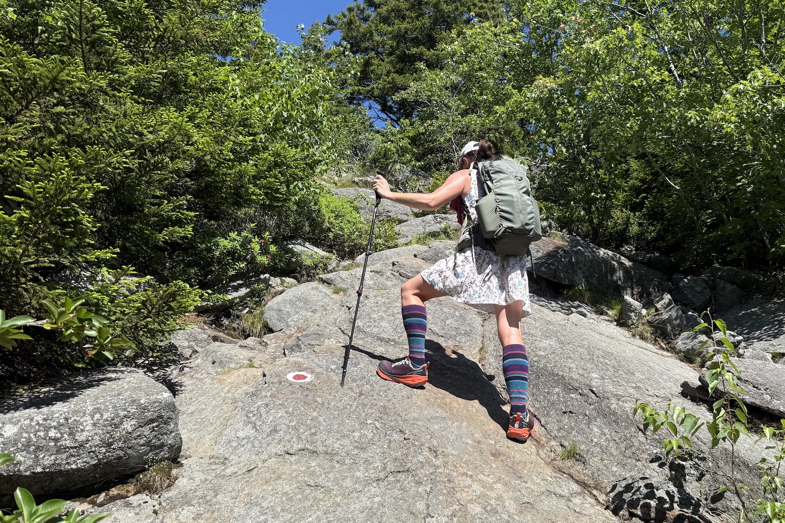 Hiker in the Altra Experience Wild 2 climbing Mount Monadnock, NH