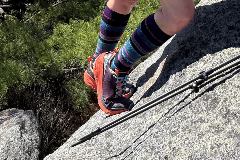 close up of Hiker in the Altra Experience Wild 2 climbing Mount Monadnock, NH