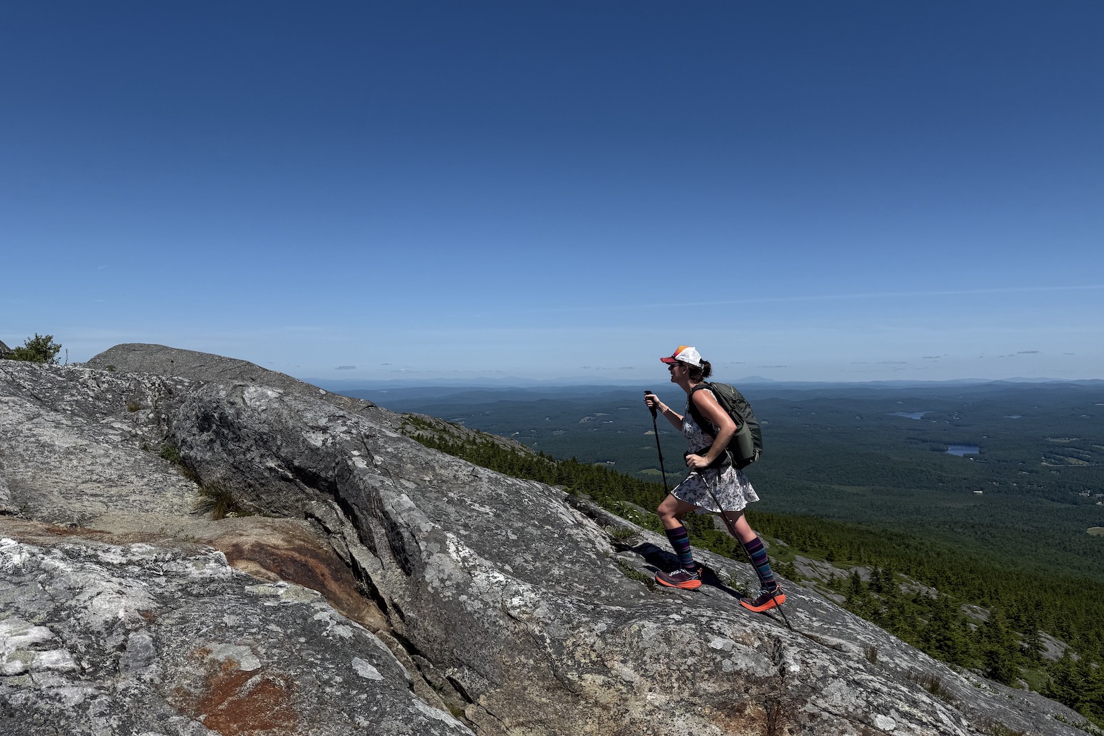 Hiker in the Altra Experience Wild 2 climbing Mount Monadnock, NH