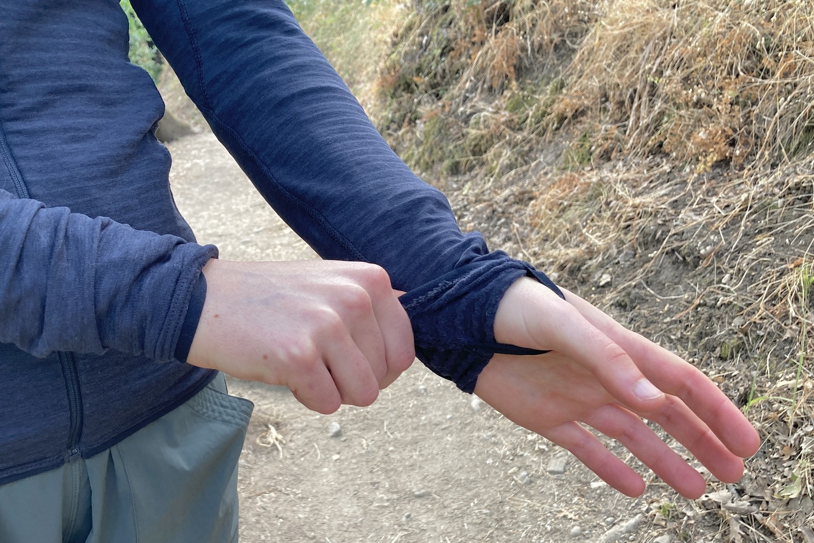 Close up showing the internal thumb loops on a fleece jacket.