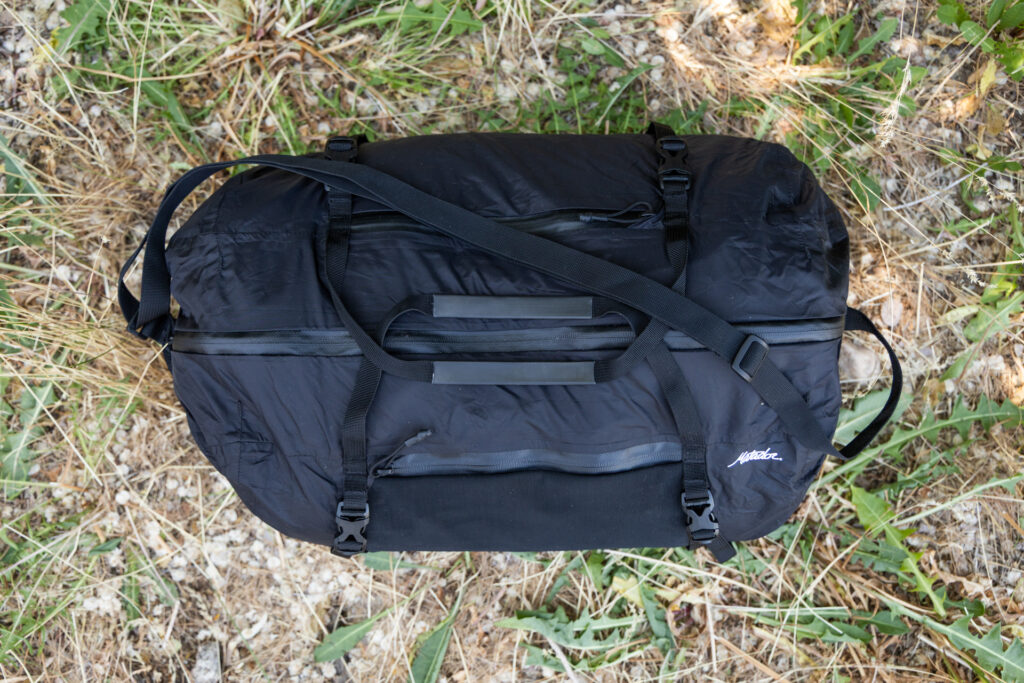 A top-down look at the Matador Freefly Packable Duffel, complete with non-removable shoulder strap and grab handles.