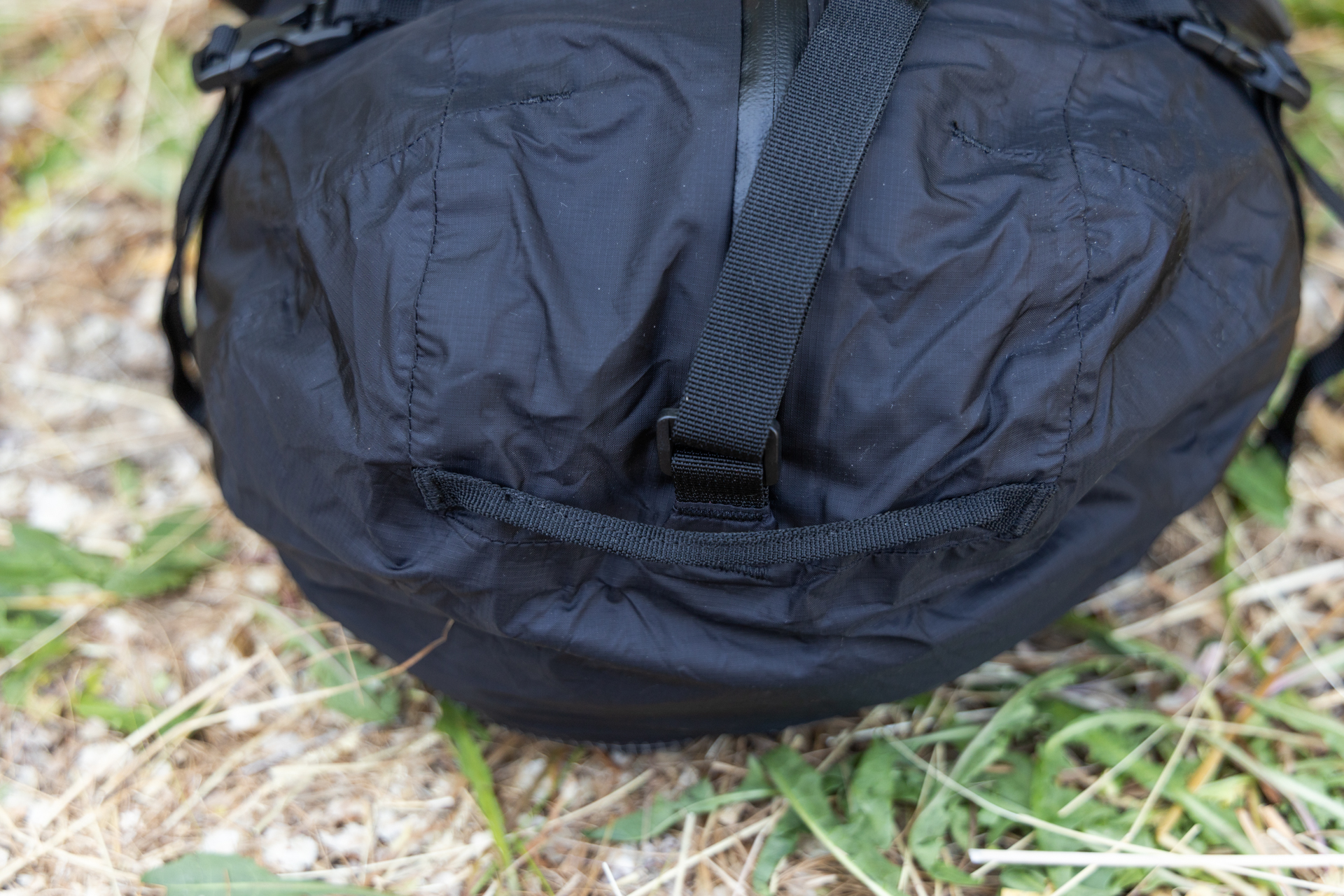 Thin webbing cargo handles on the end of the Matador Freefly Packable Duffel.