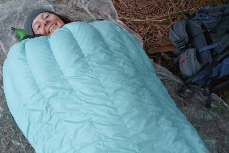 Hiker sleeping in a UGQ Bandit 20 Quilt