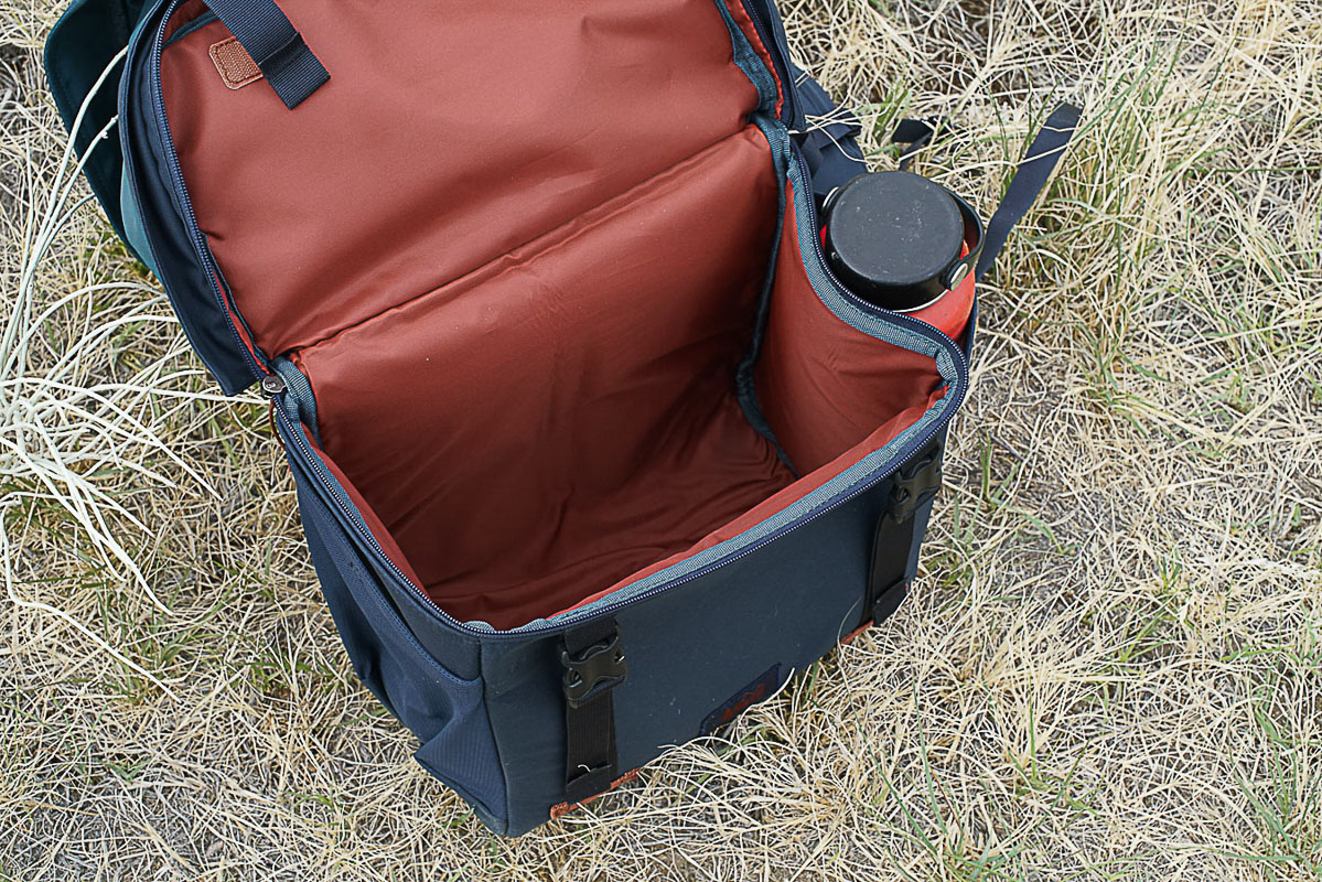 A close up looking down at the open compartment at the bottom of the REI Cool Trail Split Pack.