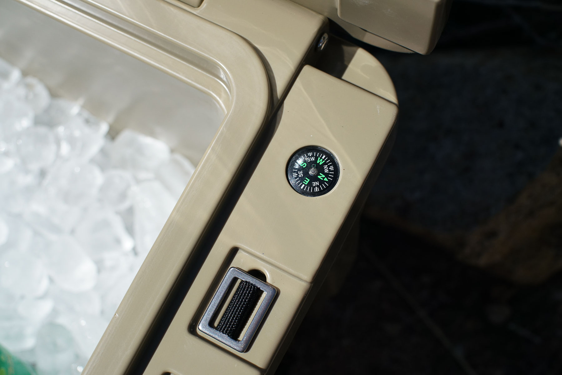 A close up of a compass built into the side of the XSpec 60QT cooler.