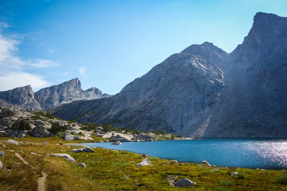 lake below granite peaks in the cirque of the towers on a sunny day