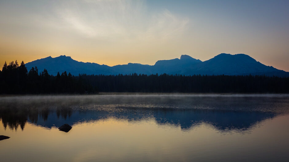 reflections of a mountain on a lake near the cirque of the towers in the wind river range