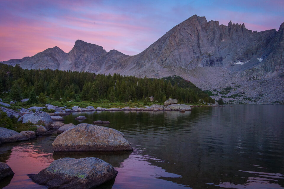 sunset clouds over a granite ridge in wyoming