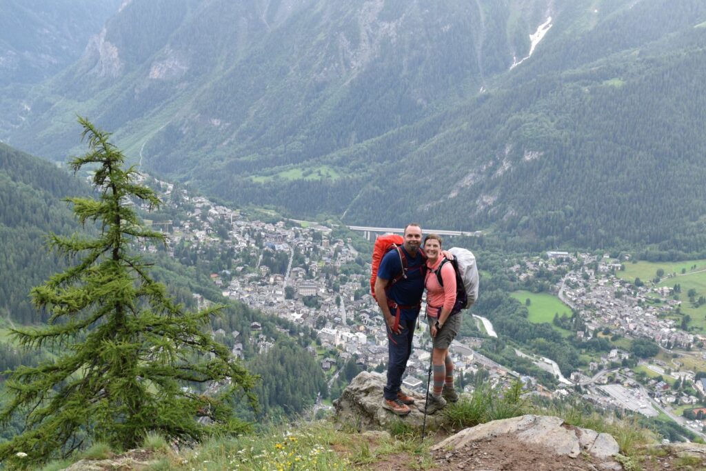 A couple stands on a small ledge 2000 feet above the Italian city they left two hours ago