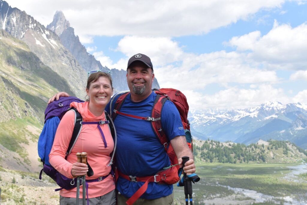 A couple pauses for a picture after descending two miles into Italy