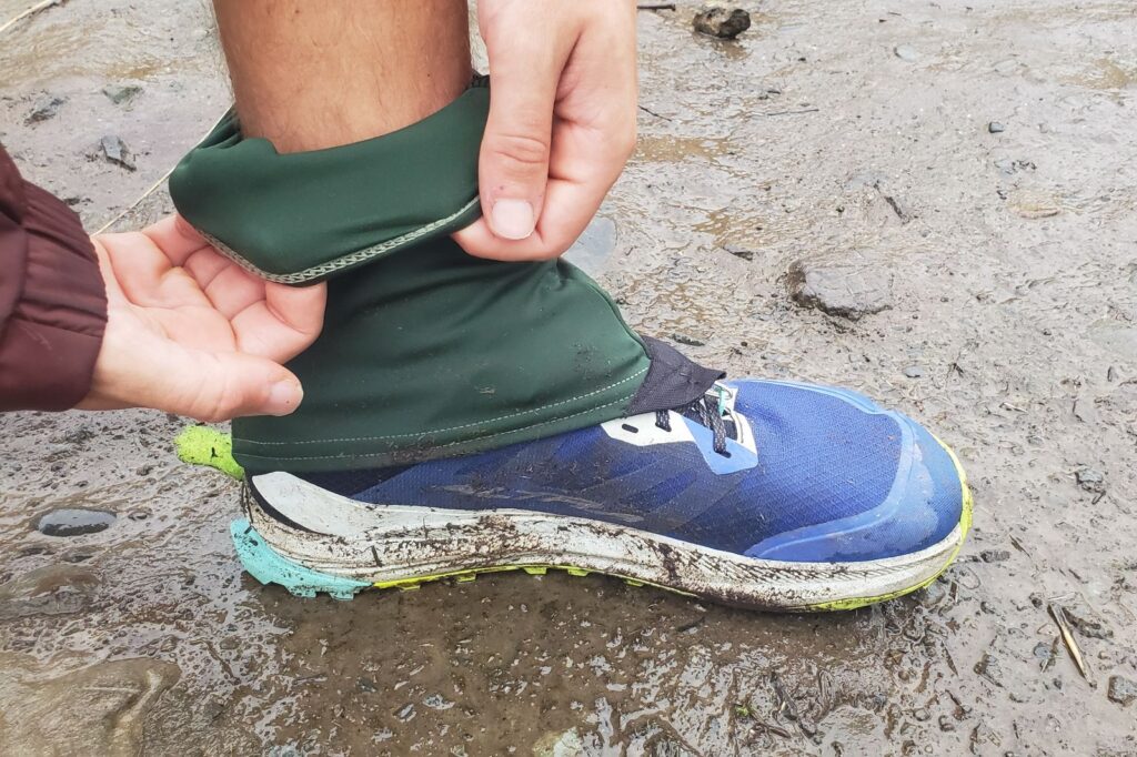 A closeup of the inner material of green hiking gaiters