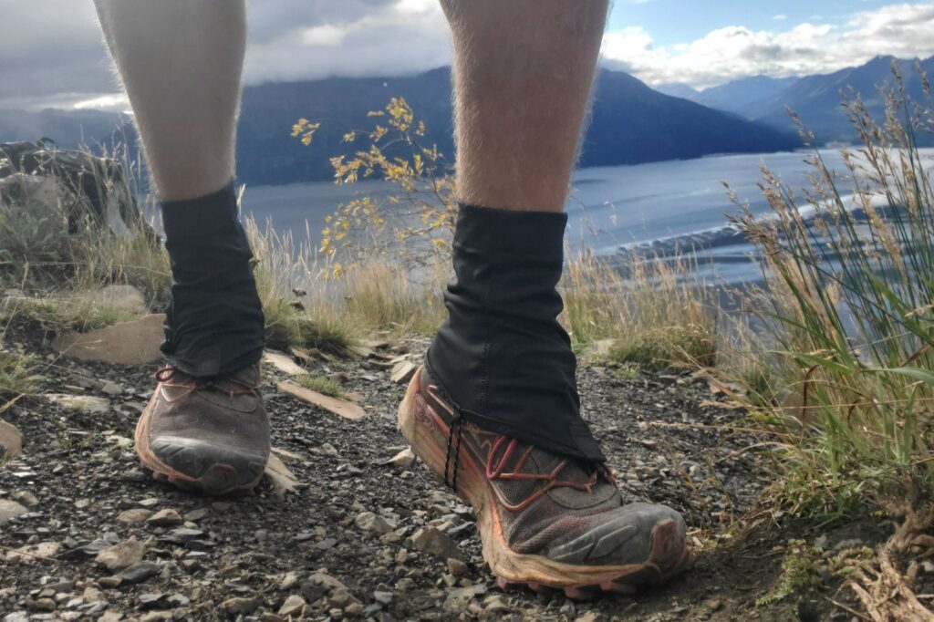 A pair of gaiters on a sunny day in the mountains.