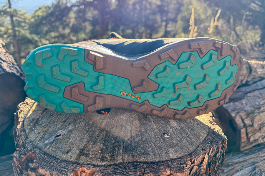 Full view of the Continental rubber outsole of the Adidas Terrex Skychaser AX5 Mid GTX Climawarm+, showing lug pattern and split-color tread design.