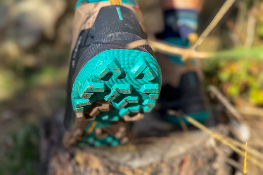 Close-up of the aggressive lugs on the outsole of the Adidas Terrex Skychaser AX5 Mid GORE-TEX Climawarm+, showing the angled design for traction.