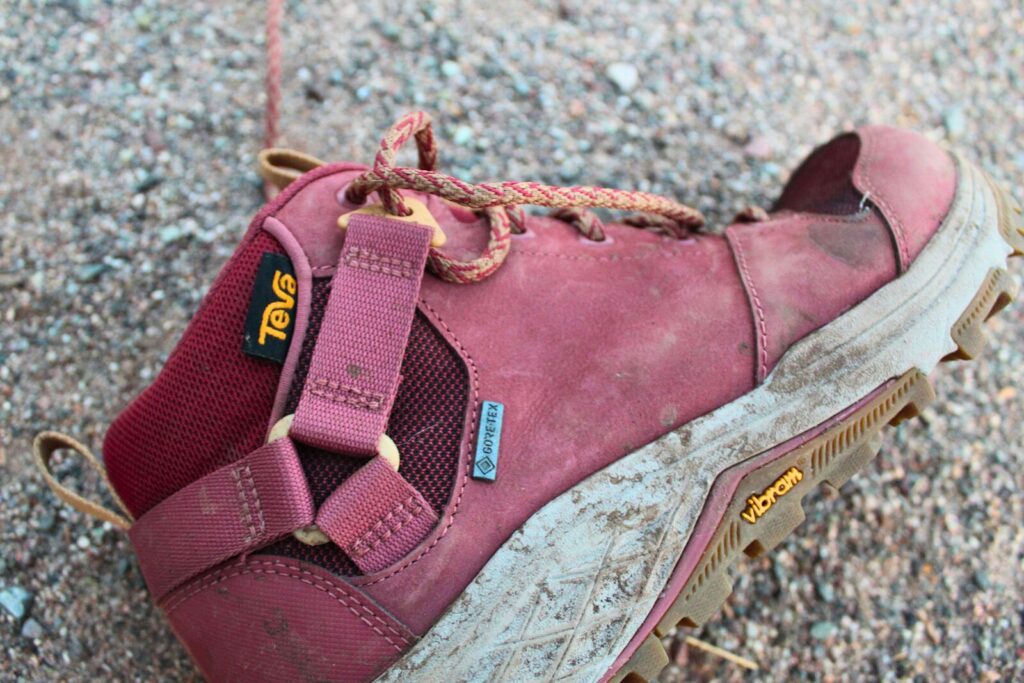 Close up of the side of the Teva Grandview GTX Mid women’s hiking boots on a dirt background