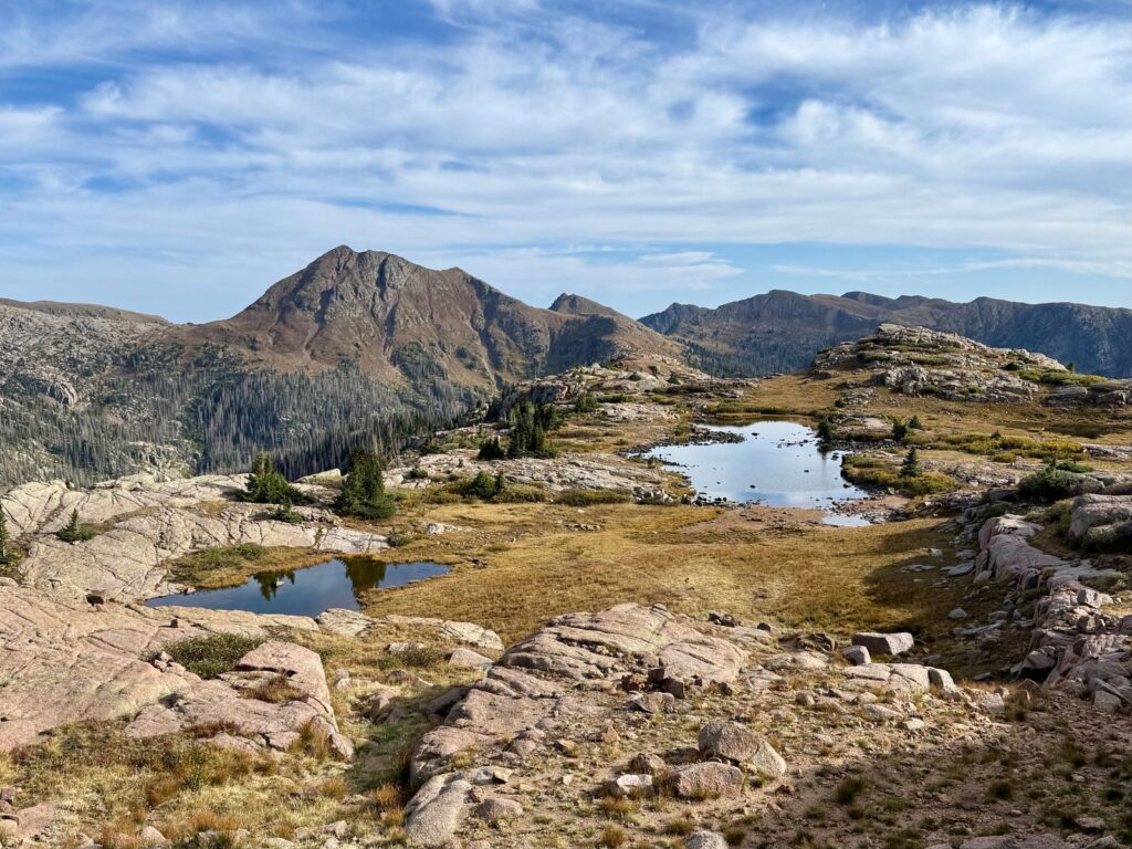 Looking down on a pair of snowmelt lakes on a plateau high up in Colorado's San Juan Mountains