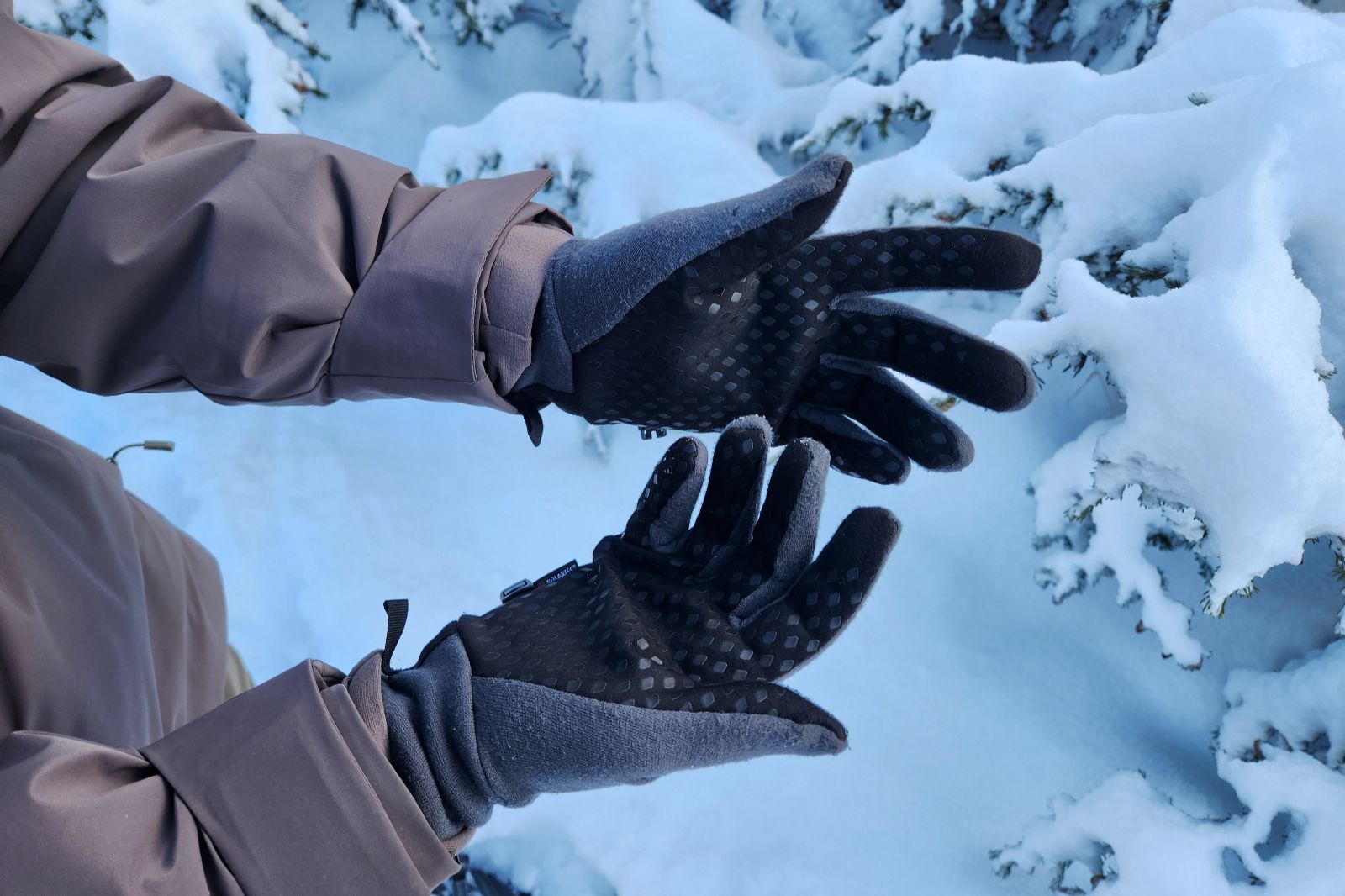 A close-up of the palm of liner gloves.