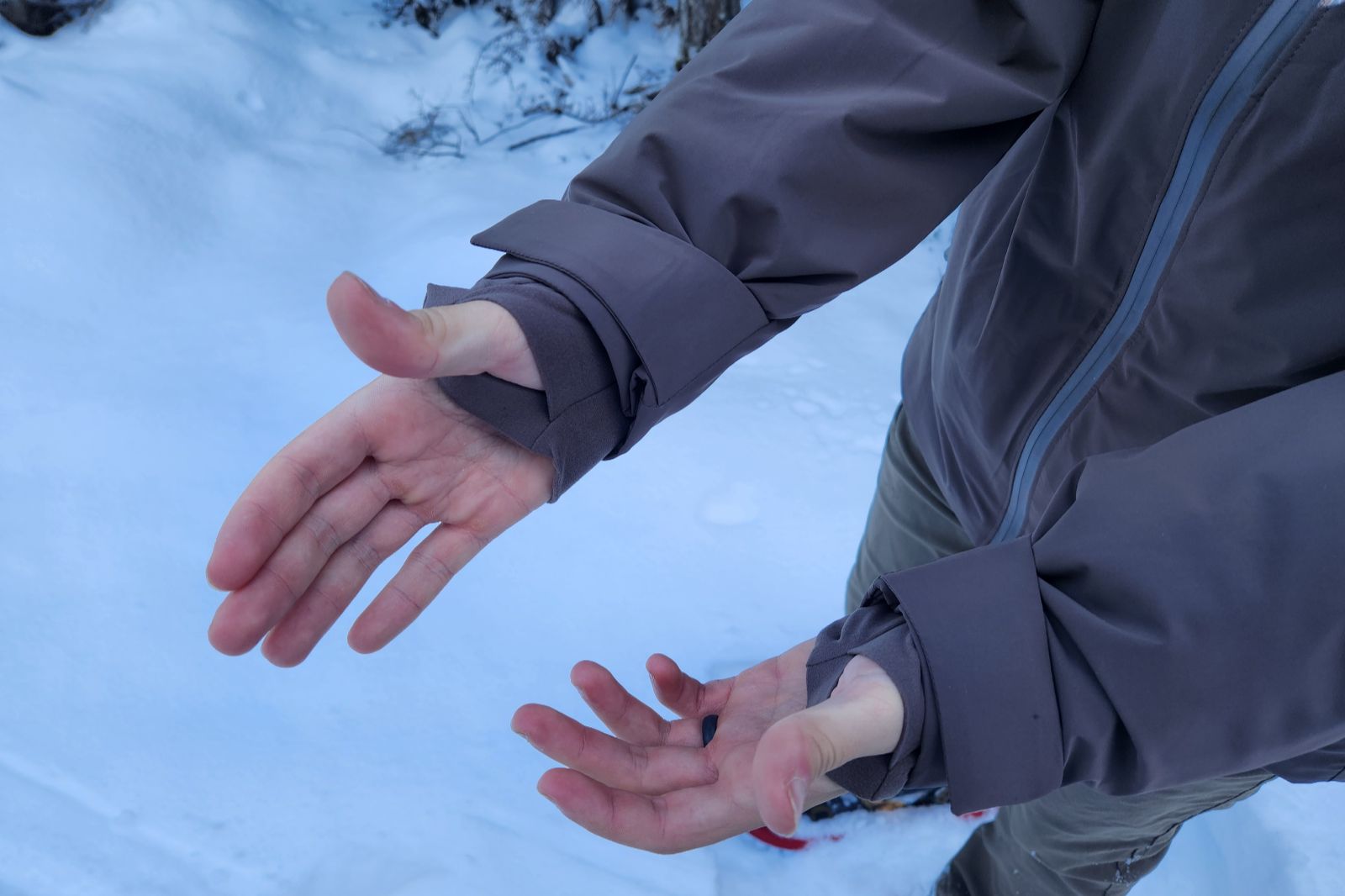 A closeup of the thumb loops on a winter jacket.