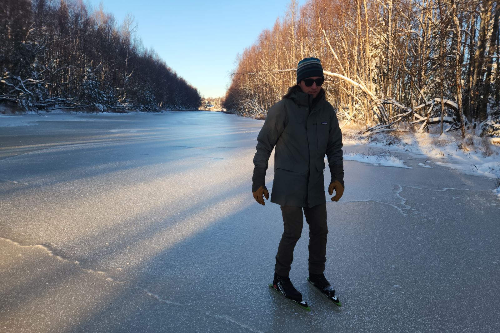A man ice skates on a frozen lake