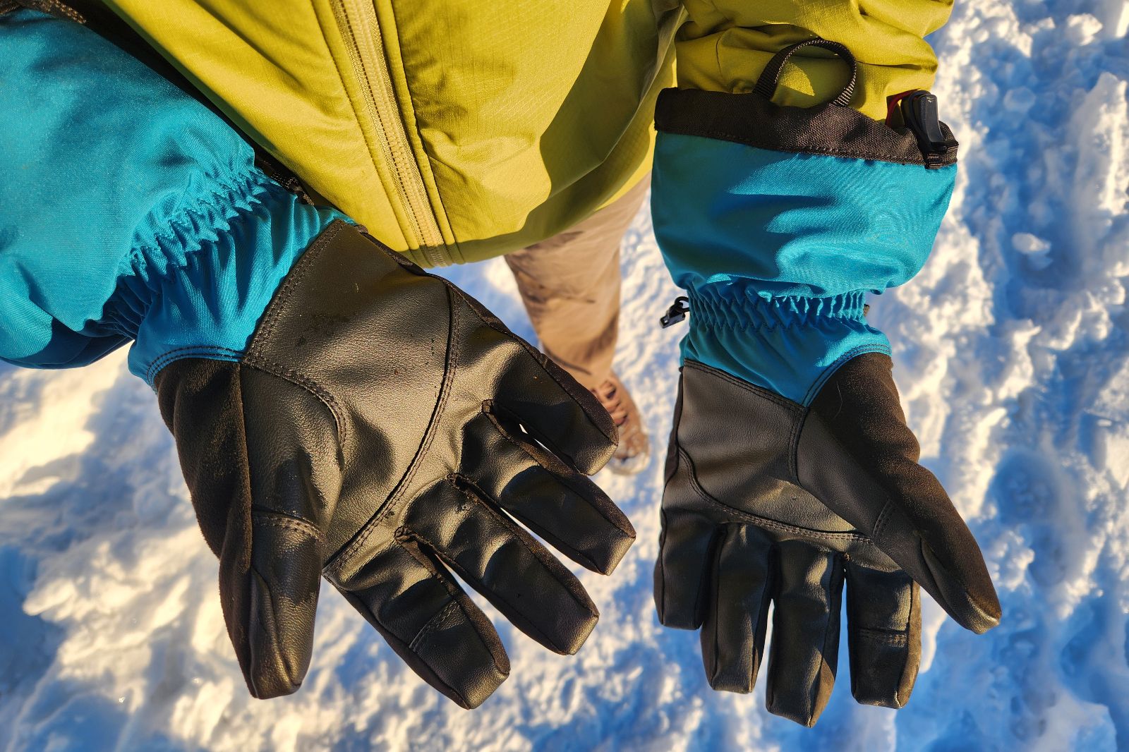 A closeup of the palms of winter gloves.
