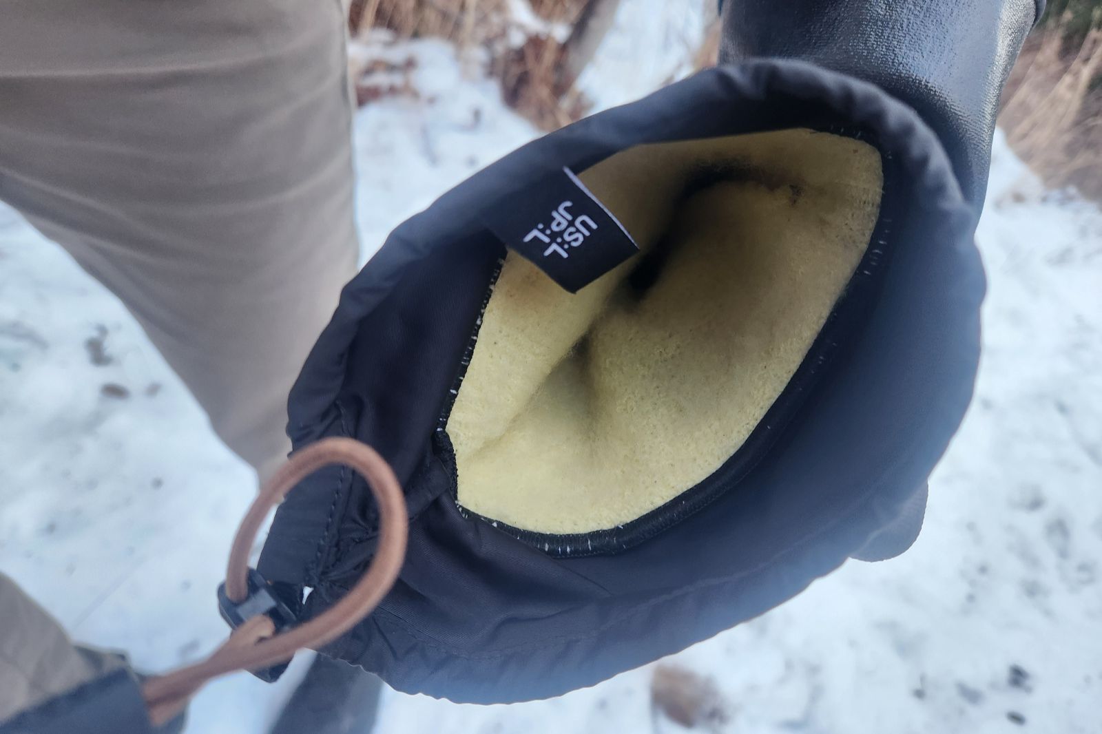 The inside of a pair of black gloves.