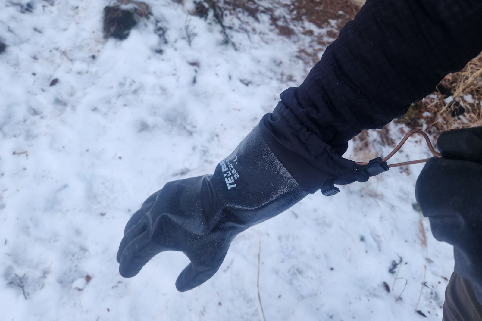 A side view of the forearm of waterproof gloves.