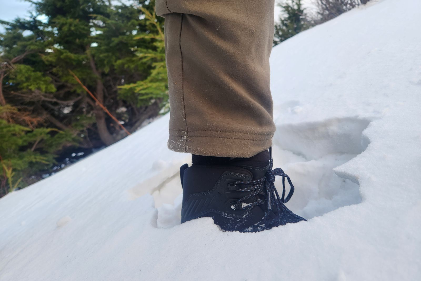 A pair of winter boots submerged in snow.