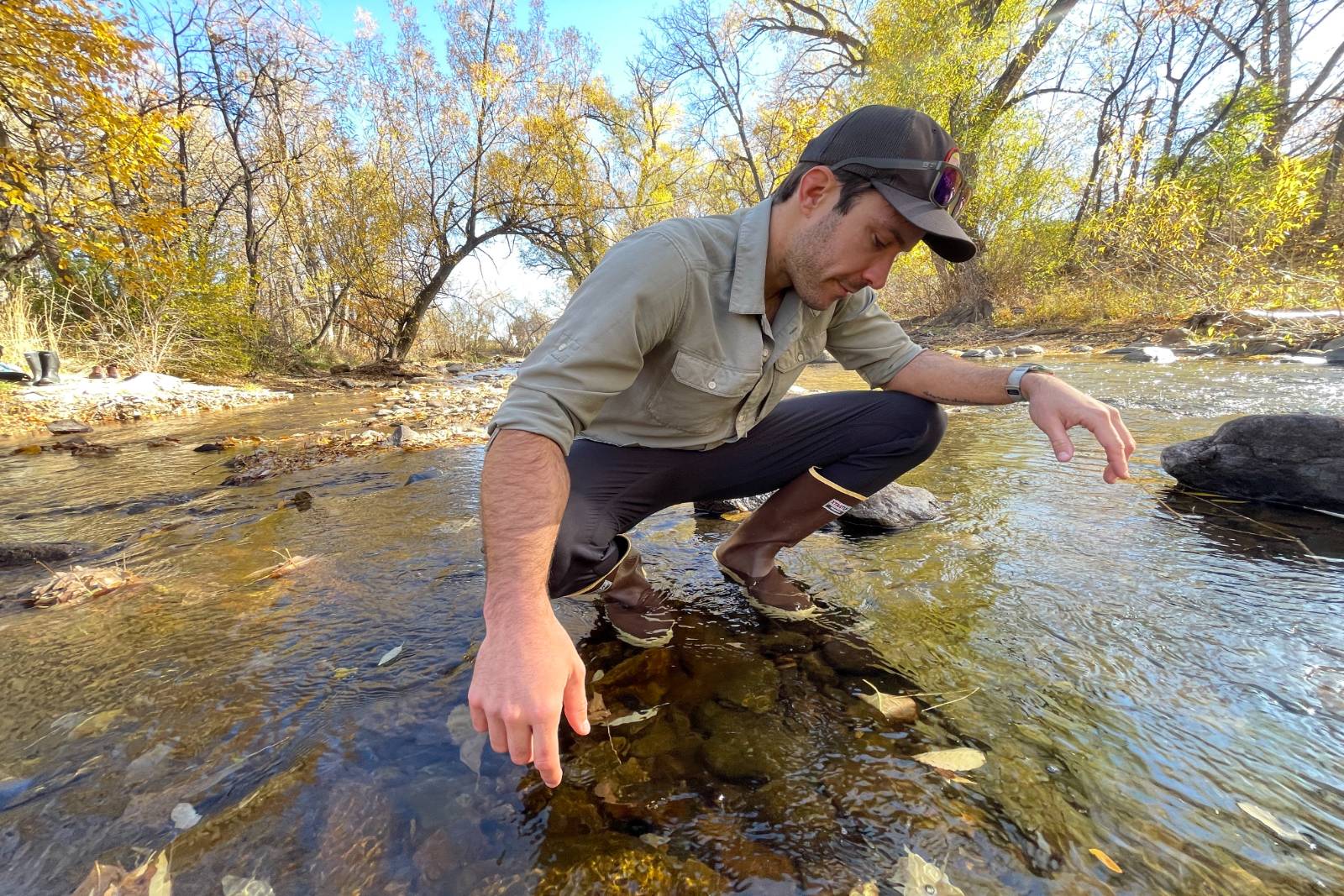 Squatting in a stream checking out some fall colored leaves in the XTRATUF 15" Legacy Boots.