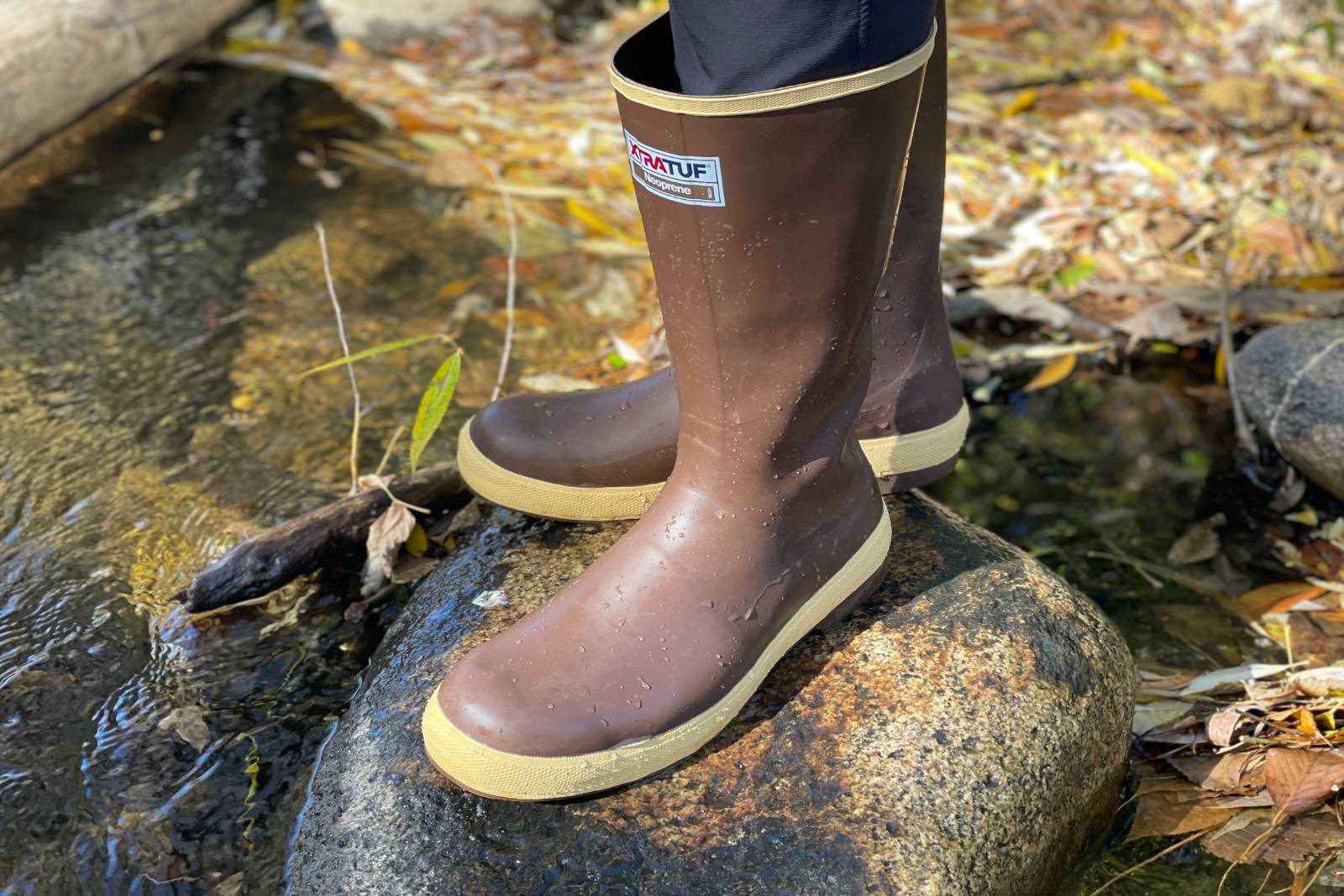 Standing on a stone in a stream in the XTRATUF 15" Legacy Boots.