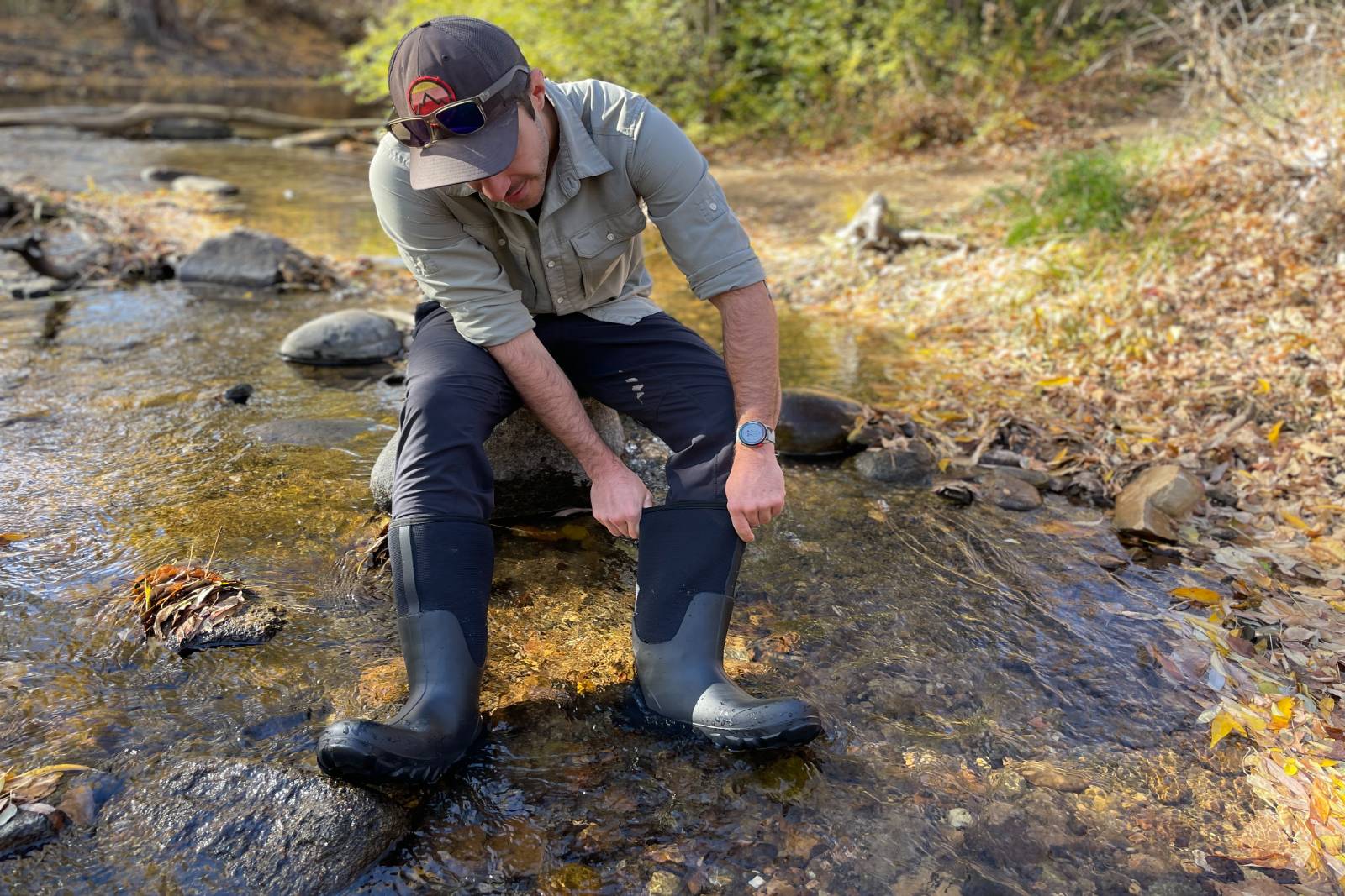 Checking out the roominess of the Bogs Classic Seamless Tall Boots while sitting in a stream.