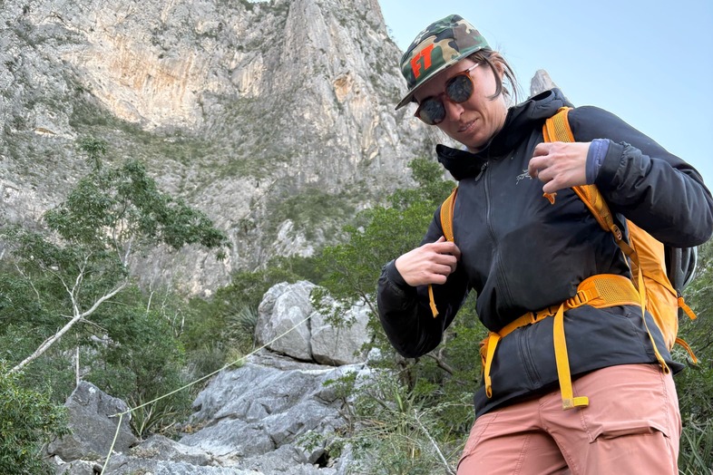 woman hiking in a black arc'teryx atom jacket