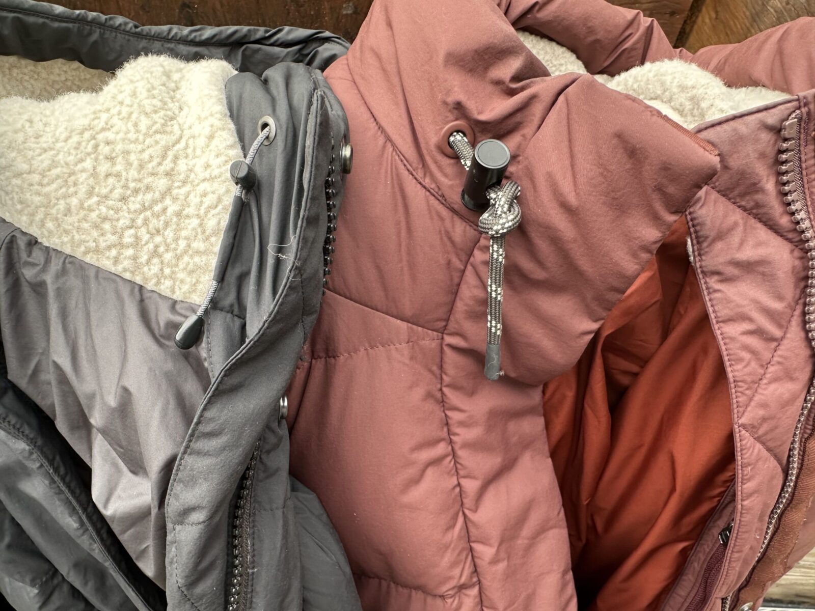 close up of the neck/hood cinch design on the rei campwell down parka