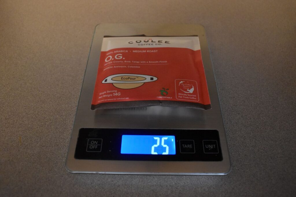 A package of Coulee Coffee on a kitchen scale which reads 25 grams