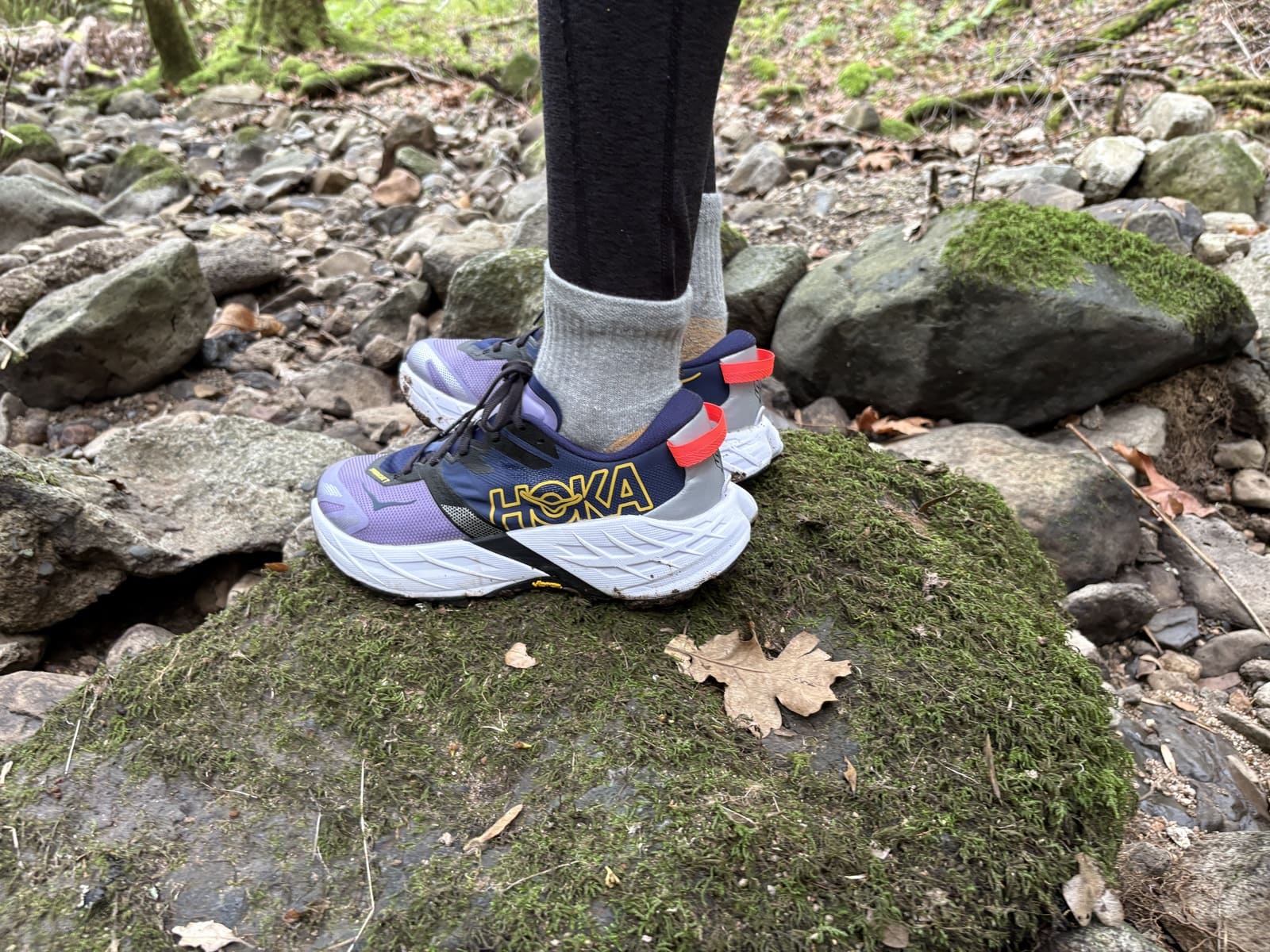 Side profile of a pair of Hoka shoes.