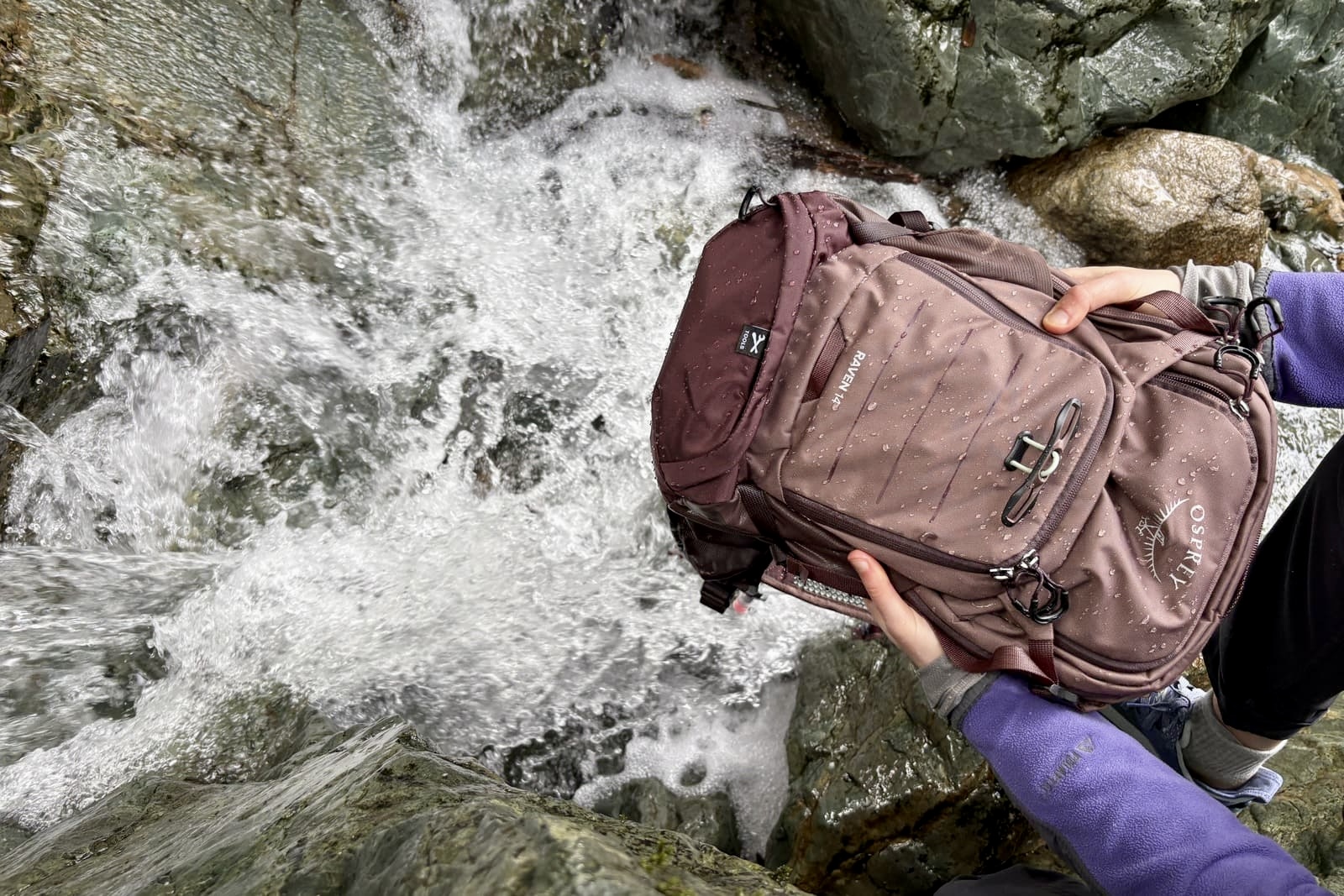 Water beads off the outside of a backpack.
