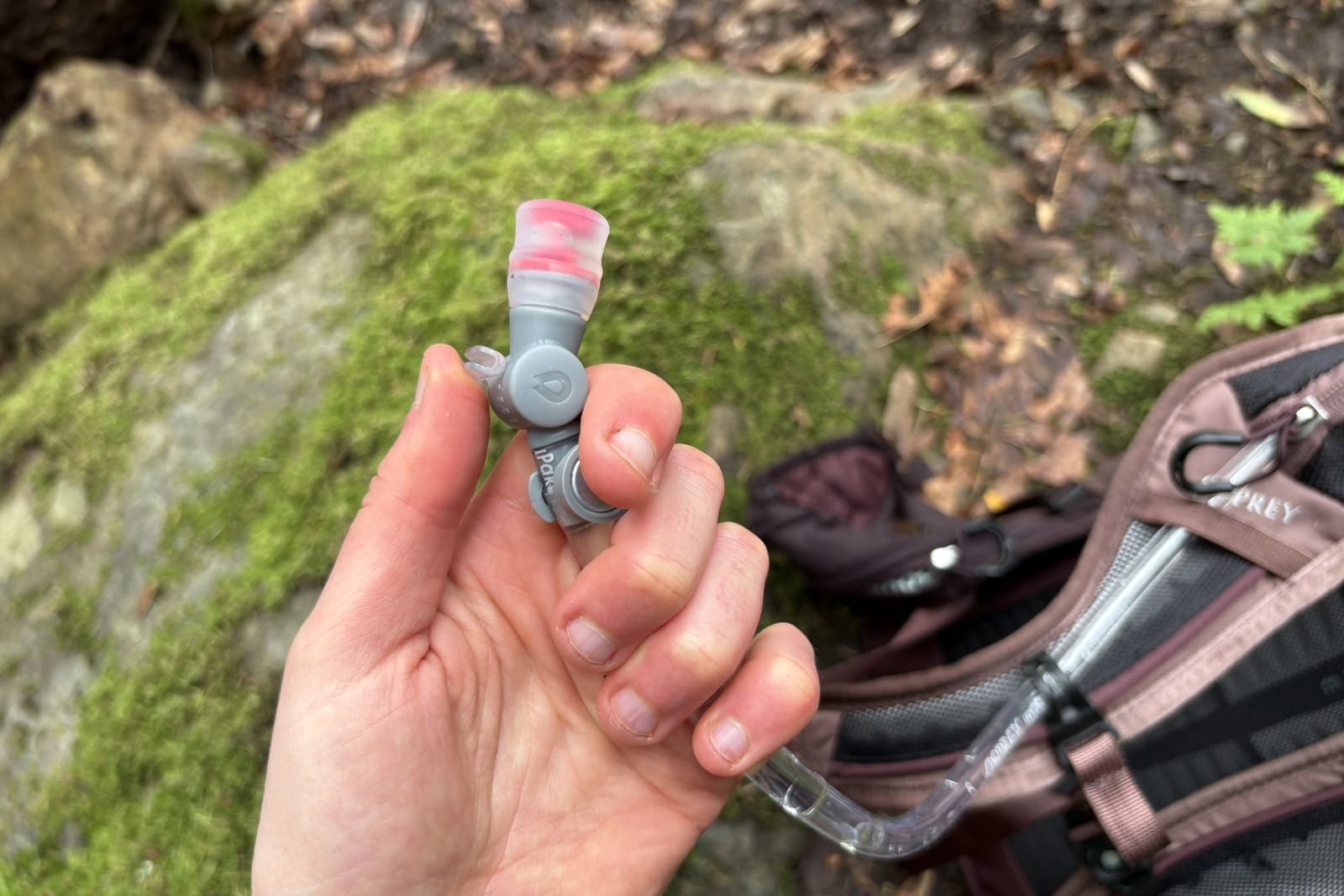 A close up of the mouthpiece on a hydration pack.