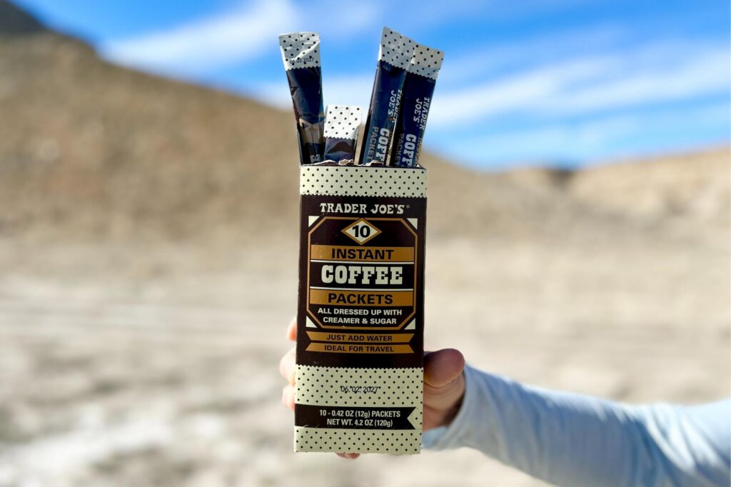 Up-close image of a box of Trader Joe's instant coffee being held by a person